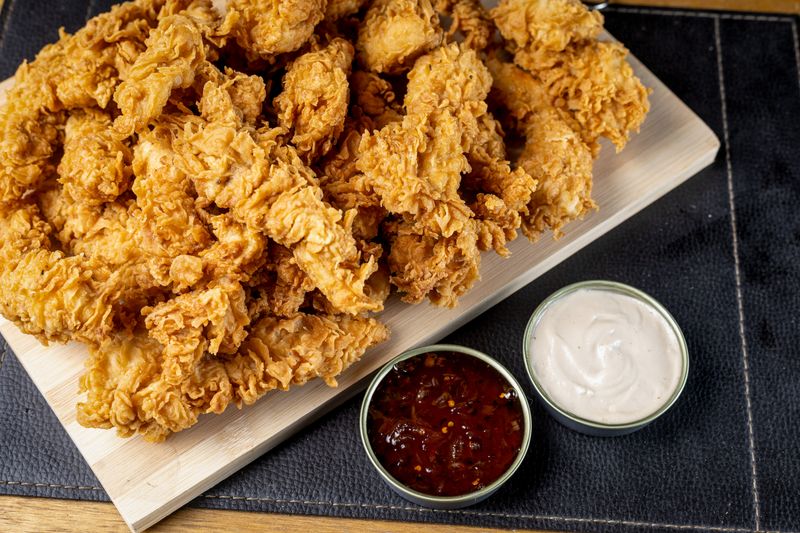 Dave's hot chicken signature sauce collection — mild to reaper heat levels